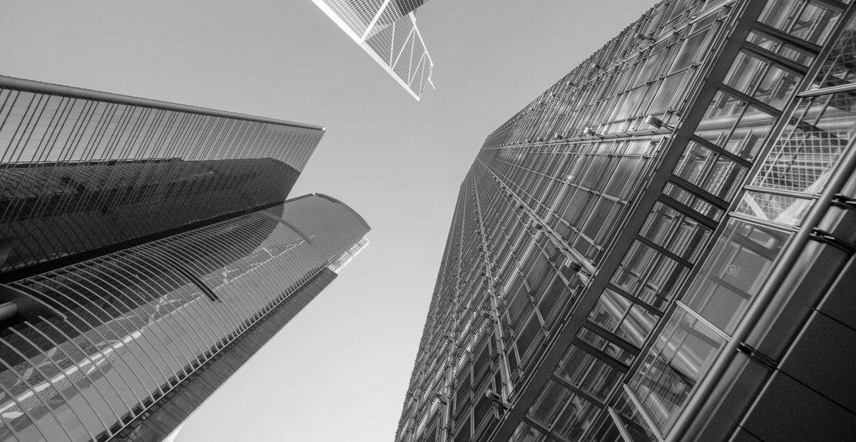 Low angle photography of buildings under blue and white sky 998499