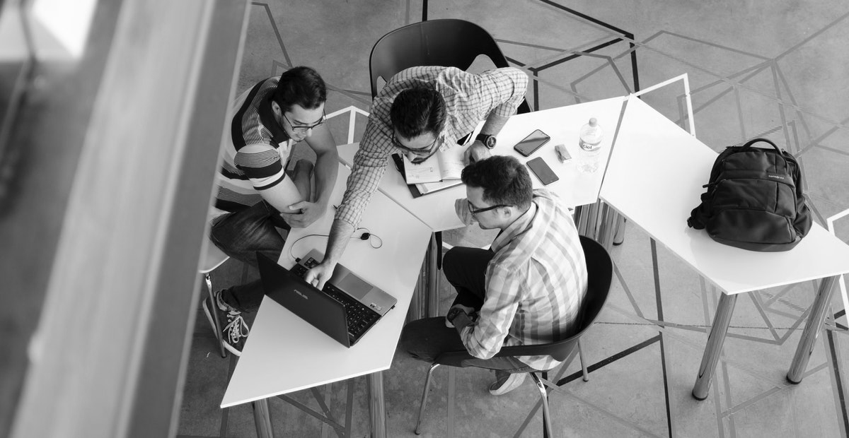 Top view photo of 3 men in front of laptop 2566581 1